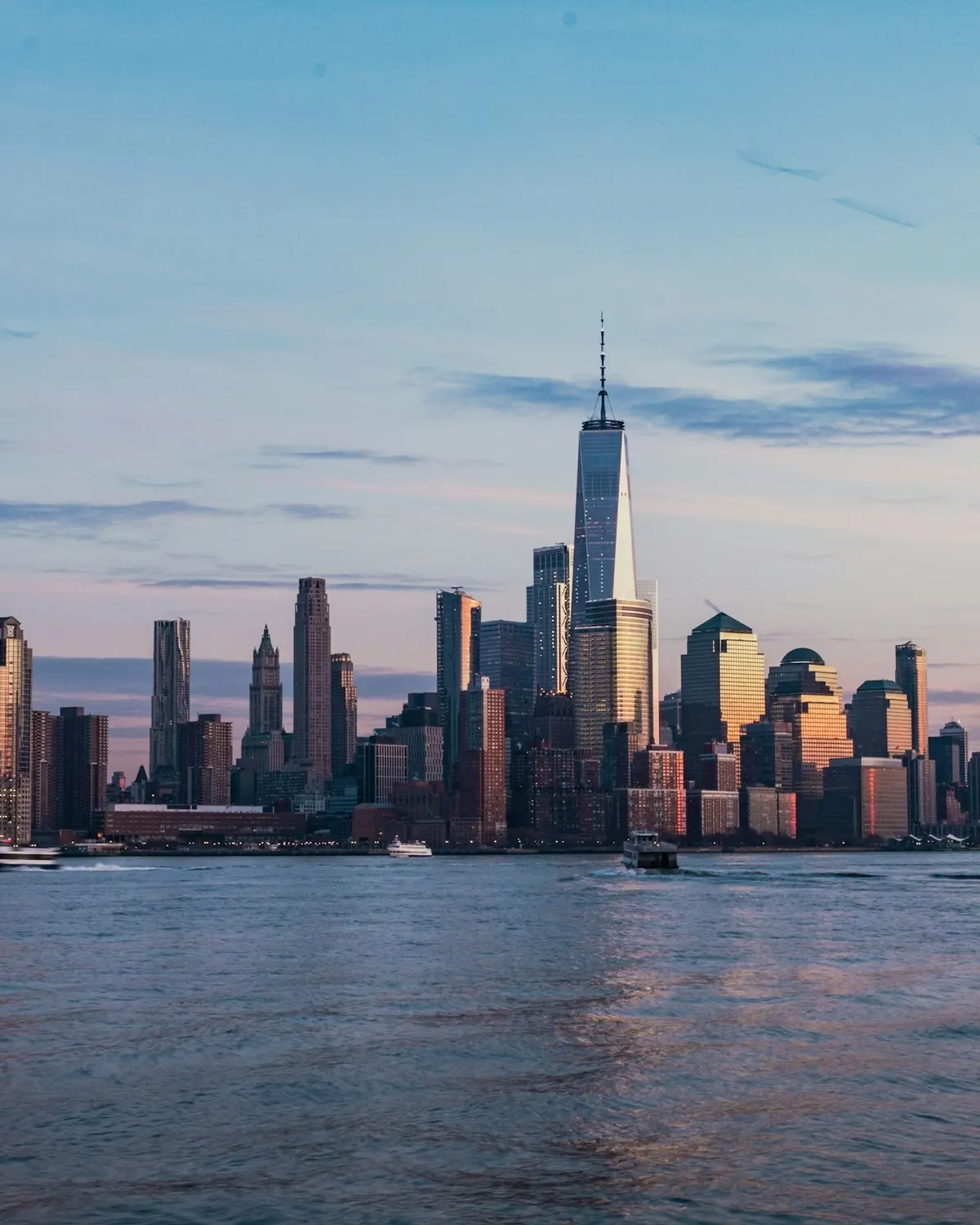 Manhattan skyline across the Hudson River at dusk
